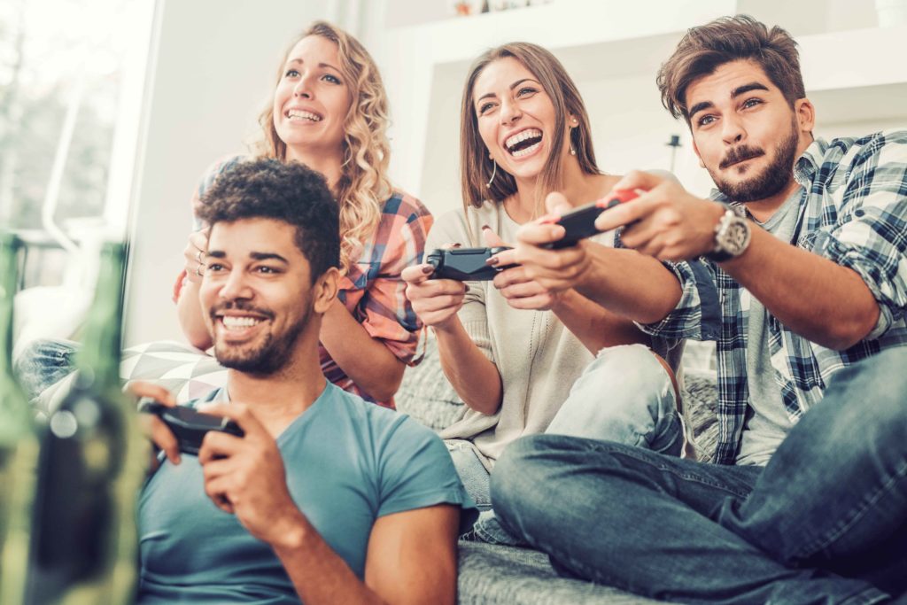 image of Young friends playing video games