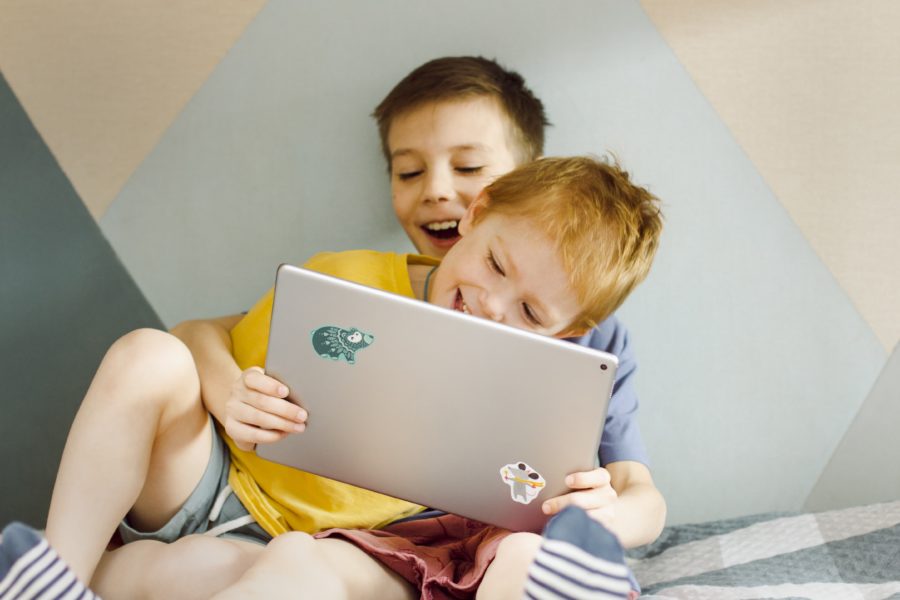 image of two children playing with an ipad